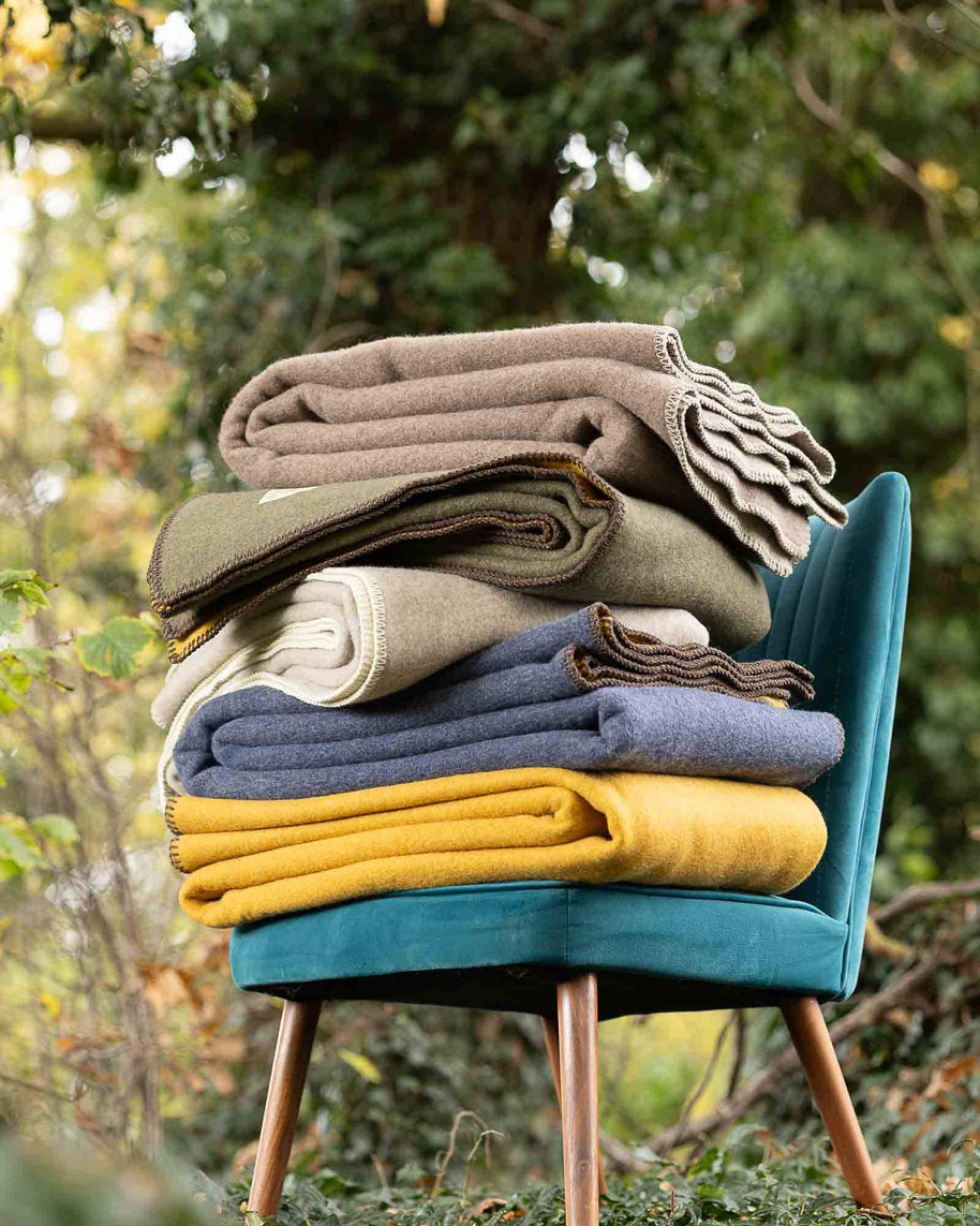 merino wollen deken verschillende kleuren groen blauw beige geel oranje